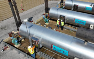 Douglas Pipeline employees checking natural gas at Aquatec plant