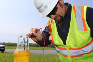 Douglas Pipeline employee checking natural gas pipeline